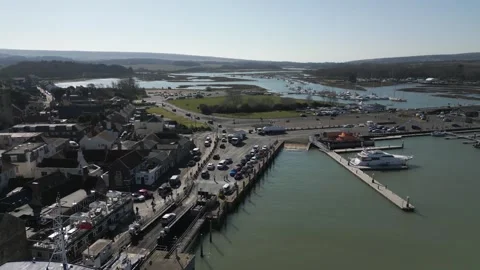 A large ship is docked at a harbor Stock Footage 306577254