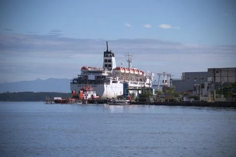 A large ship is docked at the pier Stock Photos