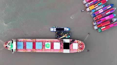 Large ship is docked at a pier with several other ships in the background Stock Footage 330760104