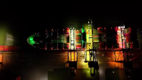 Large ship is lit up in the night sky Stock Footage 325203495