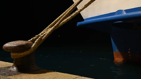 Large ship moored at the harbor pier at night Stock Footage 126604951
