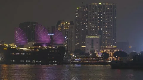 A large ship passing by Saigon River at night 4k Stock Footage 242350197