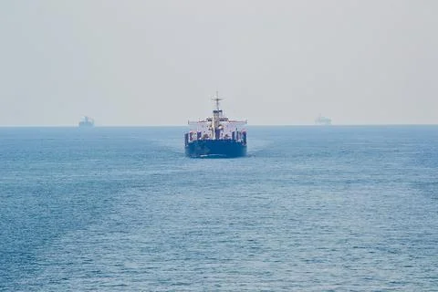 A large ship is sailing in the ocean Stock Photos