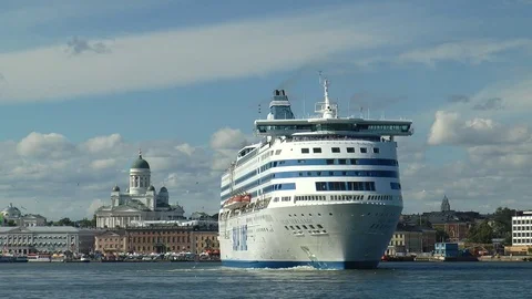 Large ship sails on a background of coastal buildings and the beautiful sky. Stock Footage 71857804