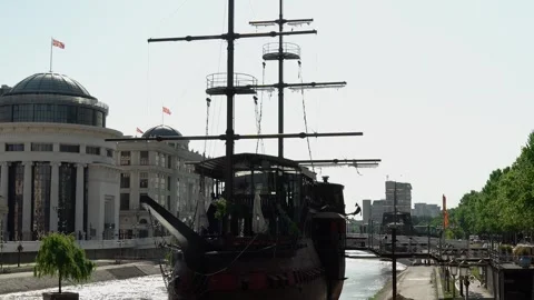 A large ship stands on the Vardar River near the pier in the center of Skopje Stock Footage 250015836