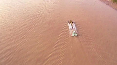 A large ship transporting concrete columns is still moving to the construction s Video stock 166780611