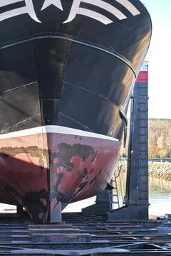 Large ship undergoing maintenance at dry dock Stock Photos