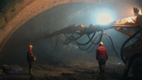 Large shotcrete machine working inside a tunnel construction Stock Footage 205088446