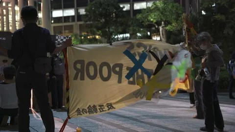 Large sign with exed-out Olympic rings in protest of the Tokyo Olympics - 4K Stock Footage 154898243