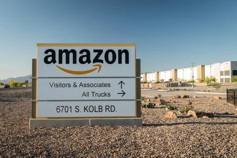 Large sign in front of Amazon fulfillment center. Stock Photos