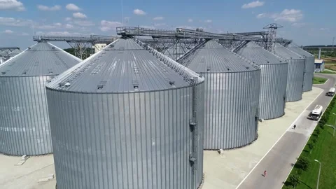 Large silver granary. Storage of grain. Feed Mill. Видео 240330238