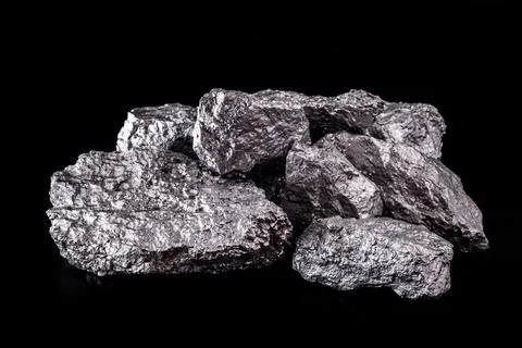 Large silver nugget on black background. Raw silver stone Stock Photos
