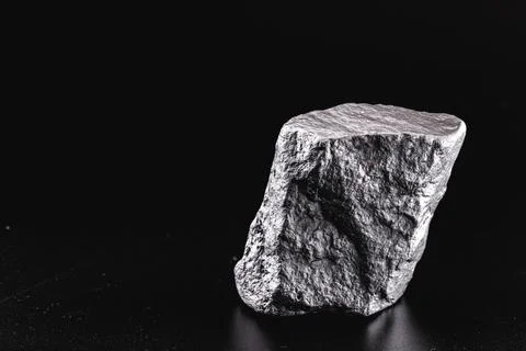 Large silver stone, rare silver nugget on black background Stock Photos
