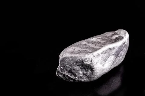 Large silver stone, rare silver nugget on black background Stock Photos