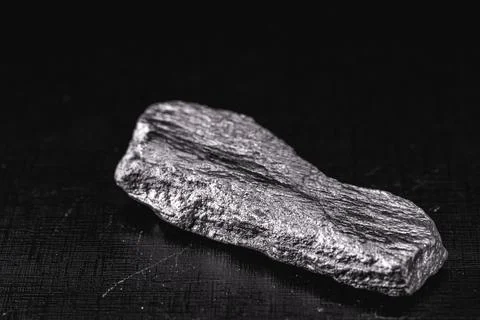 Large silver stone, rare silver nugget on black background Stock Photos