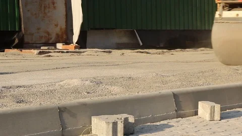 A large skating rink compacts the sand under the paving slabs Stock Footage 120332595