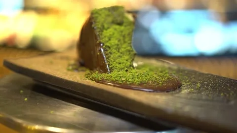 A large slice of chocolate and pistachio cake Stock Footage 167588071
