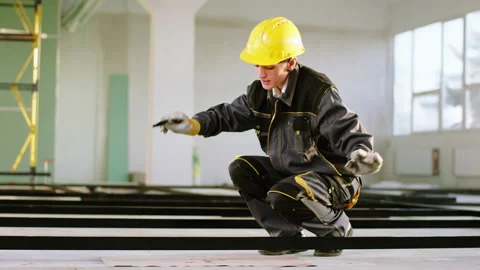 Large smile woman constructor worker at construction site using the painting Stock Footage 172573134