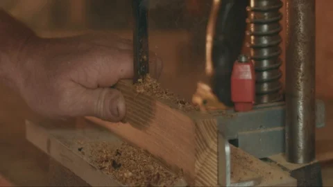 Large smoking drill fights hard wood, throwing smoking chunks of wood in Video stock 107670697