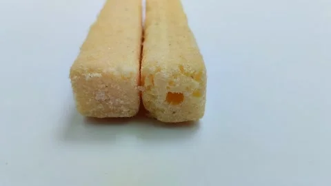 Large snack sticks with various flavors. On a white background 스톡 동영상 314930210