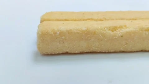Large snack sticks with various flavors. On a white background 스톡 동영상 314930213