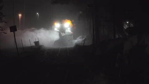 Large snow blower machine works at night at road Stock Footage 229649280