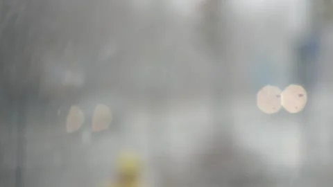 Large snow flakes on the background of the lights of passing cars Stock Footage 91442085