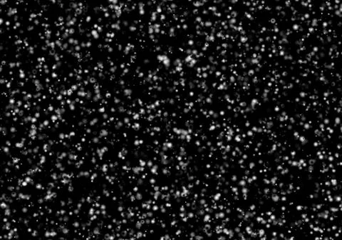 Large snow flakes fall isolated on black background Stock Photos