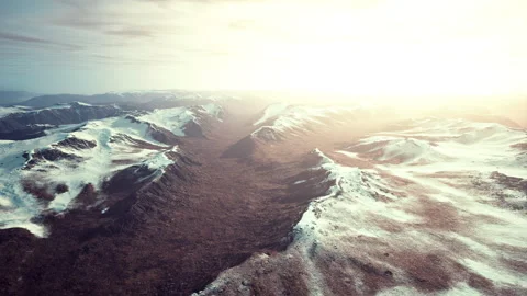 Large snow patch left over on the volcanic rock field of a mountain in summer Stock Footage 232925764