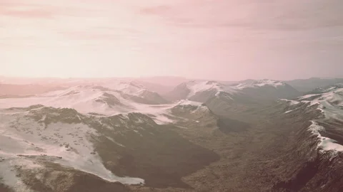 Large snow patch left over on the volcanic rock field of a mountain in summer Video stock 233203381