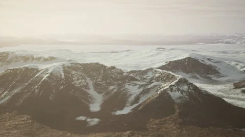 Large snow patch left over on the volcanic rock field of a mountain in summer Video stock 235896762