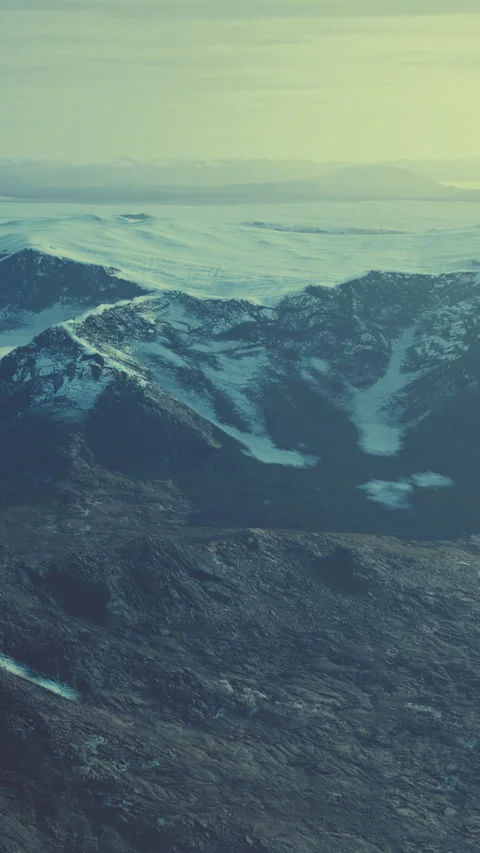 Large snow patch left over on the volcanic rock field of a mountain in summer Stock Footage 280759119