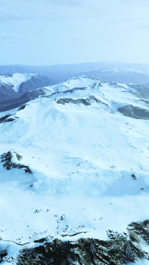 Large snow patch left over on the volcanic rock field of a mountain in summer Video stock 303897544