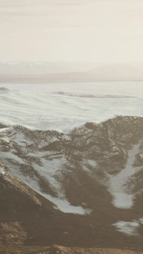 Large snow patch left over on the volcanic rock field of a mountain in summer Video stock 306289846
