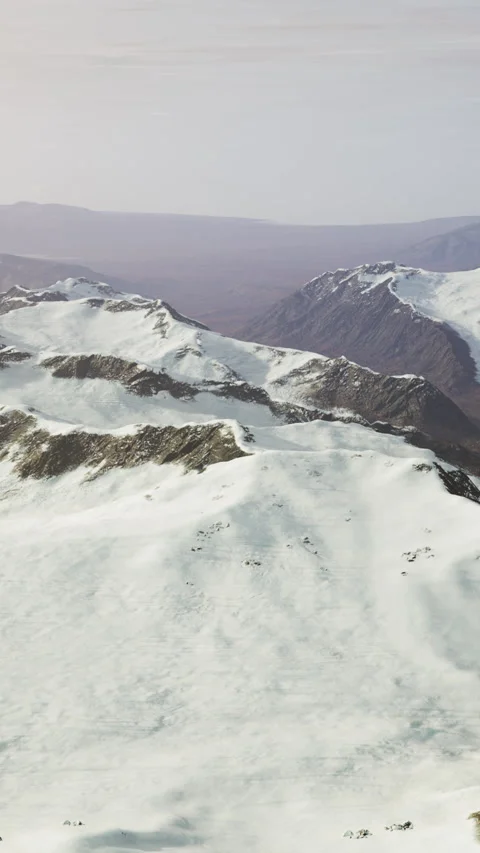 Large snow patch left over on the volcanic rock field of a mountain in summer Video stock 306306372