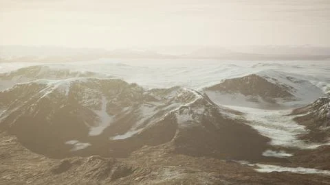 Large snow patch left over on the volcanic rock field of a mountain in summer Ilustración de archivo