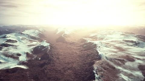 Large snow patch left over on the volcanic rock field of a mountain in summer Illustrazione stock