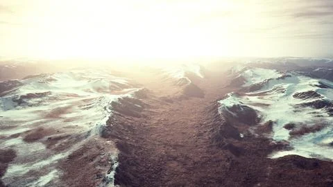 Large snow patch left over on the volcanic rock field of a mountain in summer Ilustración de archivo