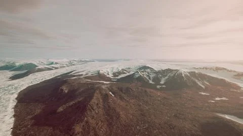 Large snow patch left over on the volcanic rock field of a mountain in summer Ilustración de archivo