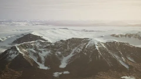 Large snow patch left over on the volcanic rock field of a mountain in summer Ilustración de archivo