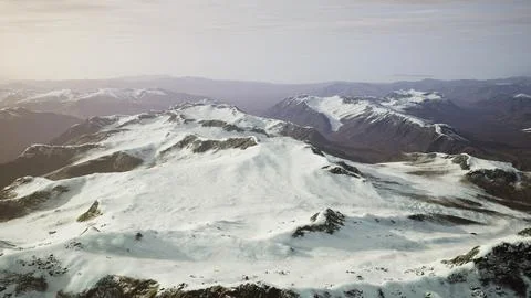 Large snow patch left over on the volcanic rock field of a mountain in summer Ilustración de archivo