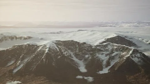 Large snow patch left over on the volcanic rock field of a mountain in summer Ilustración de archivo