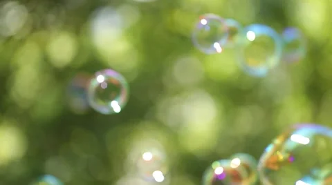 Large soap bubbles floating Stock Footage 64238768