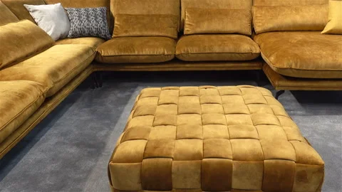 Large sofa with pillows and ottoman. Stock Footage 125662272