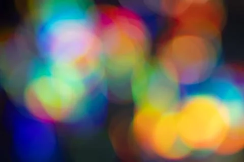 Large soft rainbow bokeh circles filling the frame for colorful party backg.. Stockfoto's