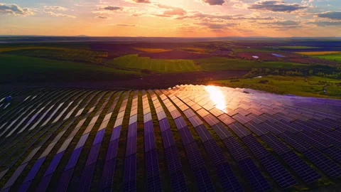 Large solar array reflecting bright sunset glare, Bulgaria. Stock-Footage 337204407