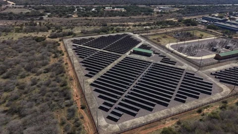 Large Solar Farm Surrounded by African Landscape From Above Video stock 342625312