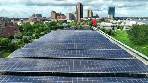 Large solar panel array above parking garage outside of downtown American Stock Footage 245794461