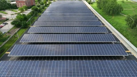 Large solar panel array. Aerial tilt up reveal of Toledo, Ohio skyline on Stock Footage 245793679