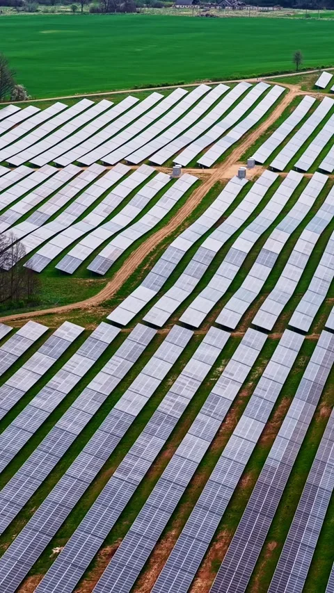 Large solar panel array in field with farmland. Stock Footage 336507702